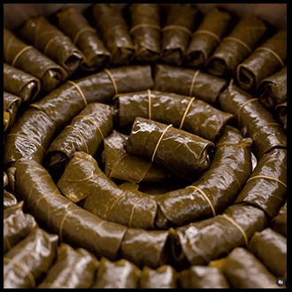 Homemade dolma stuffed with rice, herbs, and minced meat.