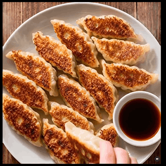 Pan-fried gyoza with dipping sauce