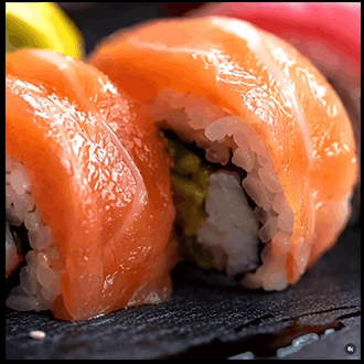 Rainbow sushi roll topped with vibrant slices of fresh tuna, salmon, and avocado

